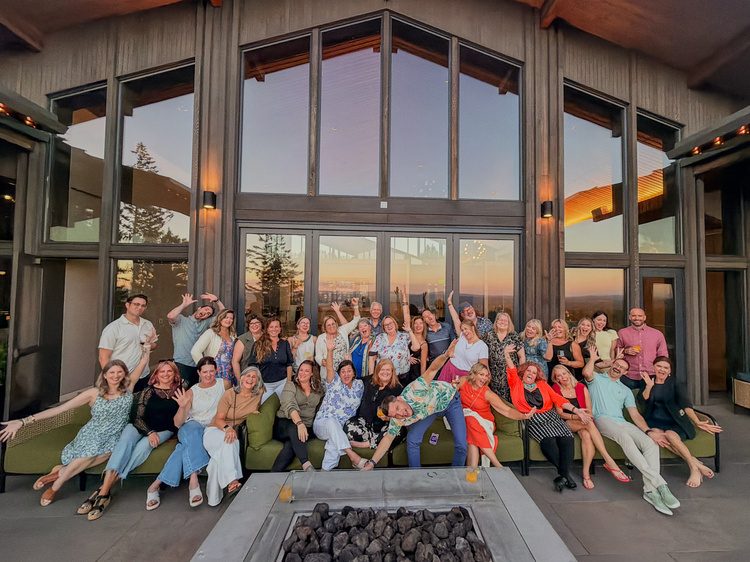 The group gathered around a fire pit in the evening