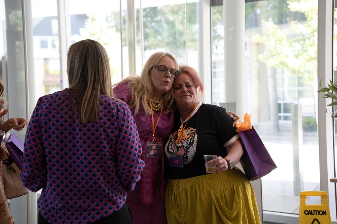 Two participants talking during a break